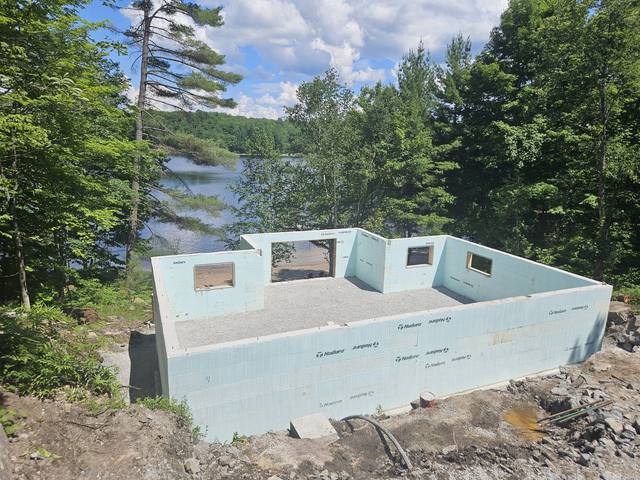 ICF foundation walls taking shape above the lake