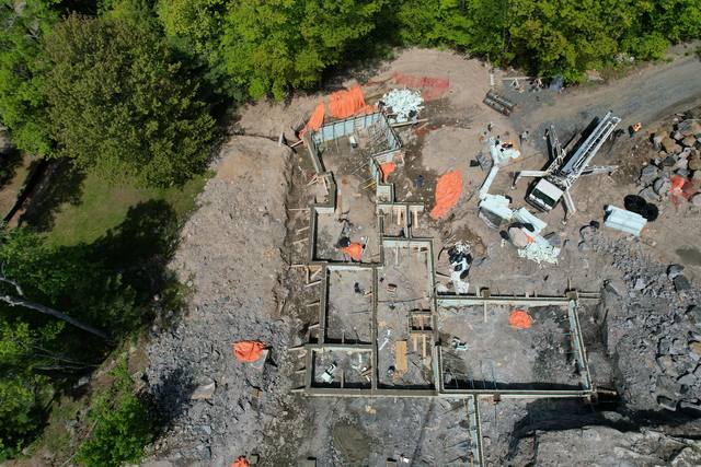 The full footing and pier layout from above, stepped across broken rock