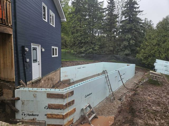 An ICF wall tied in against a finished modern home