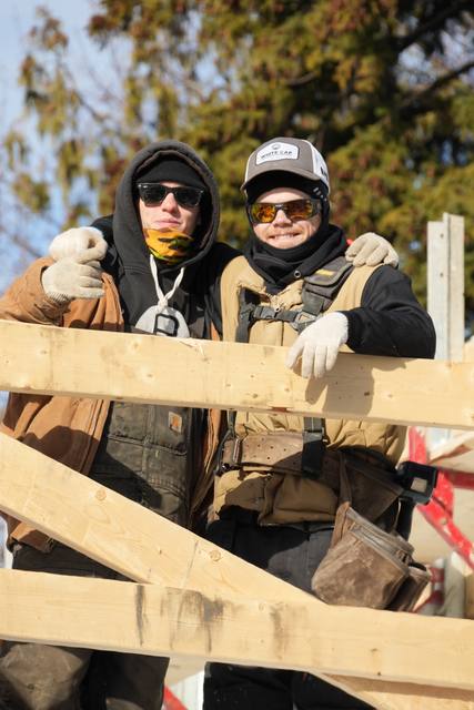 On the bracing, mid-winter — two of the crew at an ICF wall pour