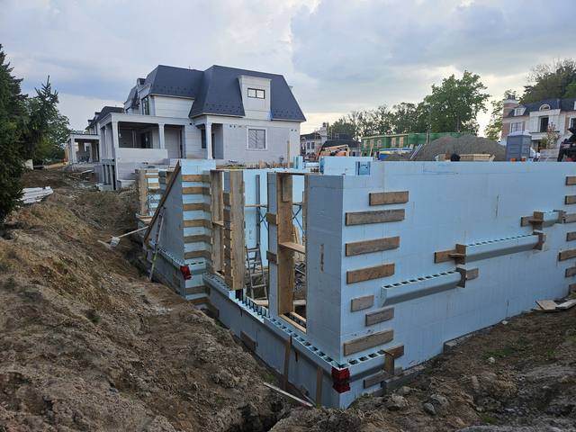Braced and aligned on a sloped lot, stepping down with the grade