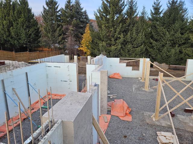 Walls up and interior stone in, gable ends carried above the deck line