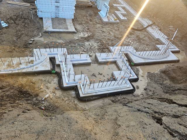 Pebble Ridge — footing forms laid out across broken rock at first light