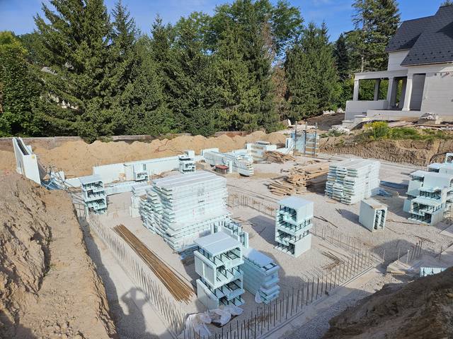 Pebble Ridge — the full ICF foundation from the driveway, house behind