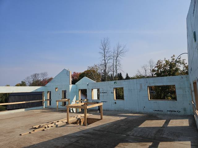 A raft-slab build with ICF walls and gables carried to the roof